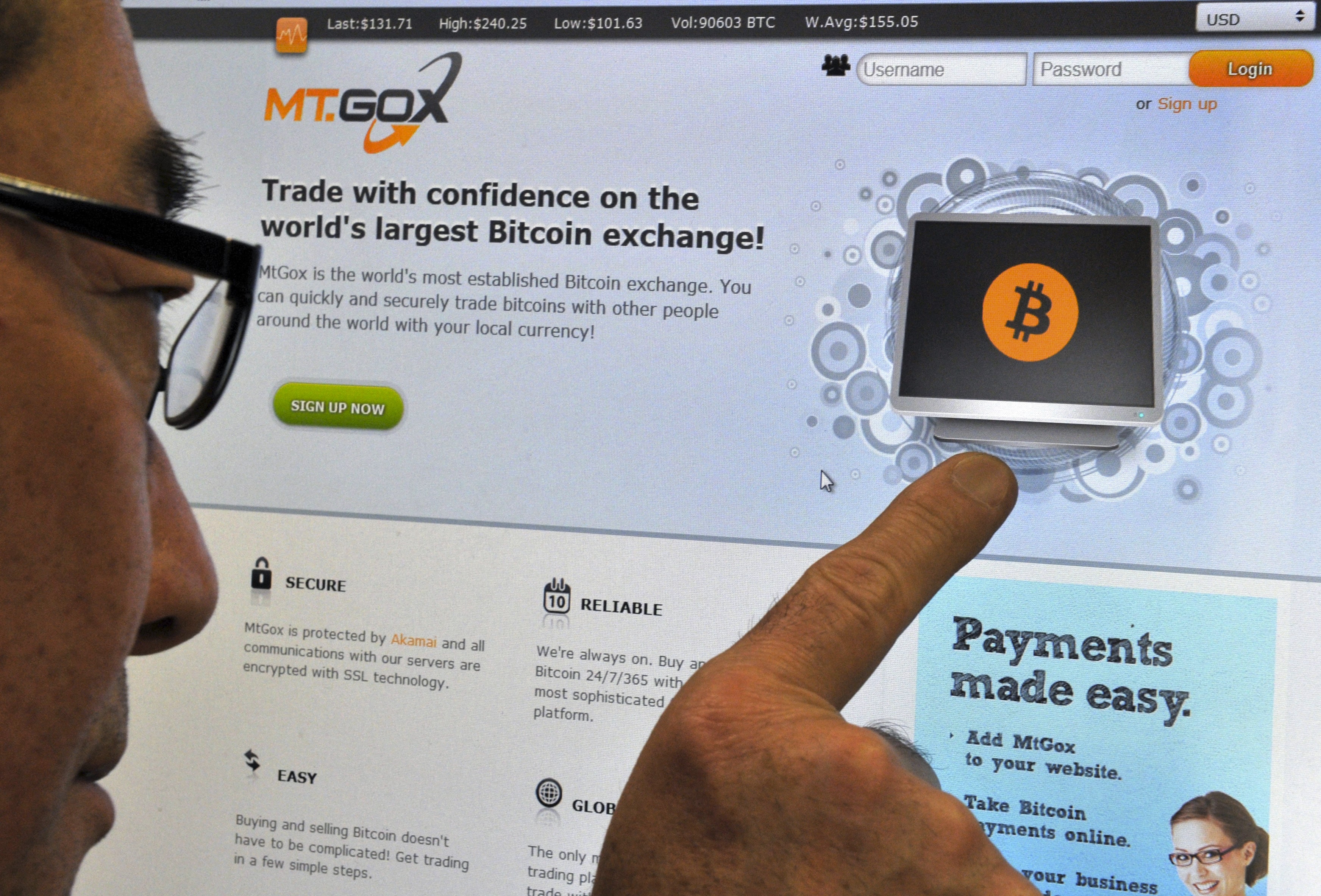 This photo shows a man looking at a bitcoin exchange website in Tokyo, Japan, on February 25, 2014. (AFP/ File)