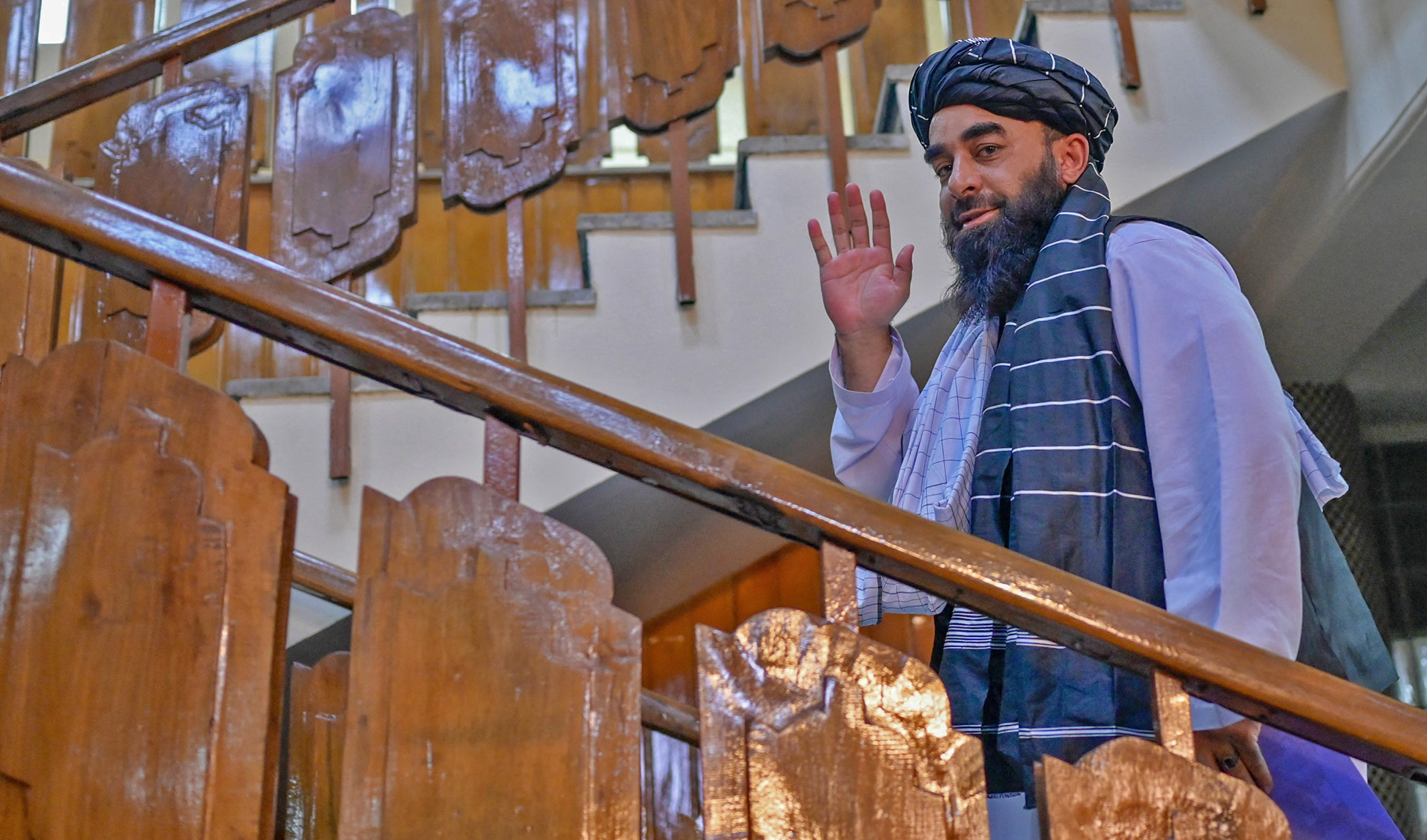 Afghan Taliban government chief spokesman Zabihullah Mujahid leaves after addressing a press conference in Kabul on September 21, 2021 (AFP/File)