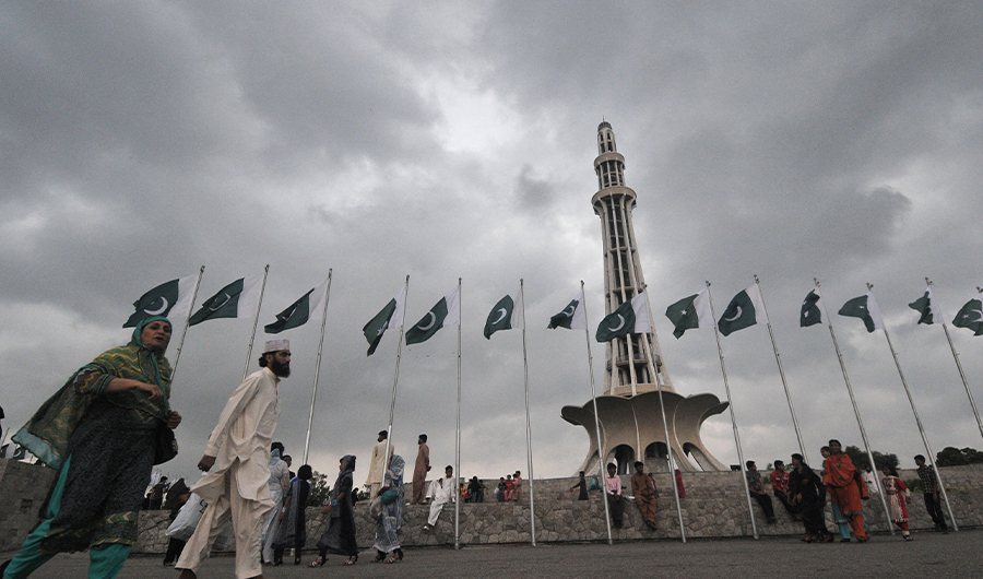 Pakistanis gather in front of the Minar-e-Pakistan, the historic monument for the struggle for independence, ahead of the country's Independence Day in Lahore on August 13, 2013. (AFP/FILE)