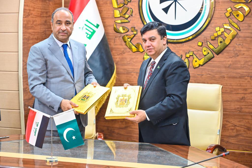 Iraqi Culture Minister Hassan Nadhem and Pakistan Ambassador Ahmed Amjad Ali sign a memorandum of understanding on tourism cooperation in Baghdad on January 19, 2022. (Photo courtesy: Pakistan Embassy, Baghdad)