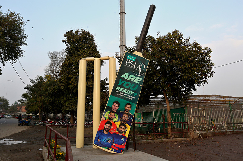 Huge wickets and a bat, with the pictures of cricket players, display near the Gaddafi Stadium for the upcoming country's premier domestic Twenty20 tournament 'Pakistan Super League' in Lahore, Pakistan, Tuesday, Jan. 25, 2022. (AP)