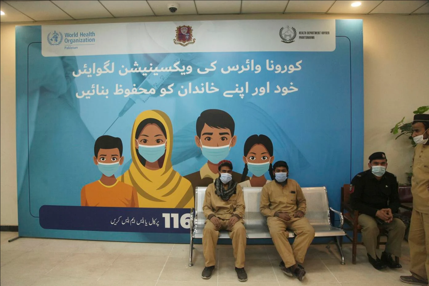 A man waits his turn to receive the dose of COVID-19 vaccine at a vaccination center, in Peshawar, Pakistan, Friday, Jan. 21, 2022 (AP)