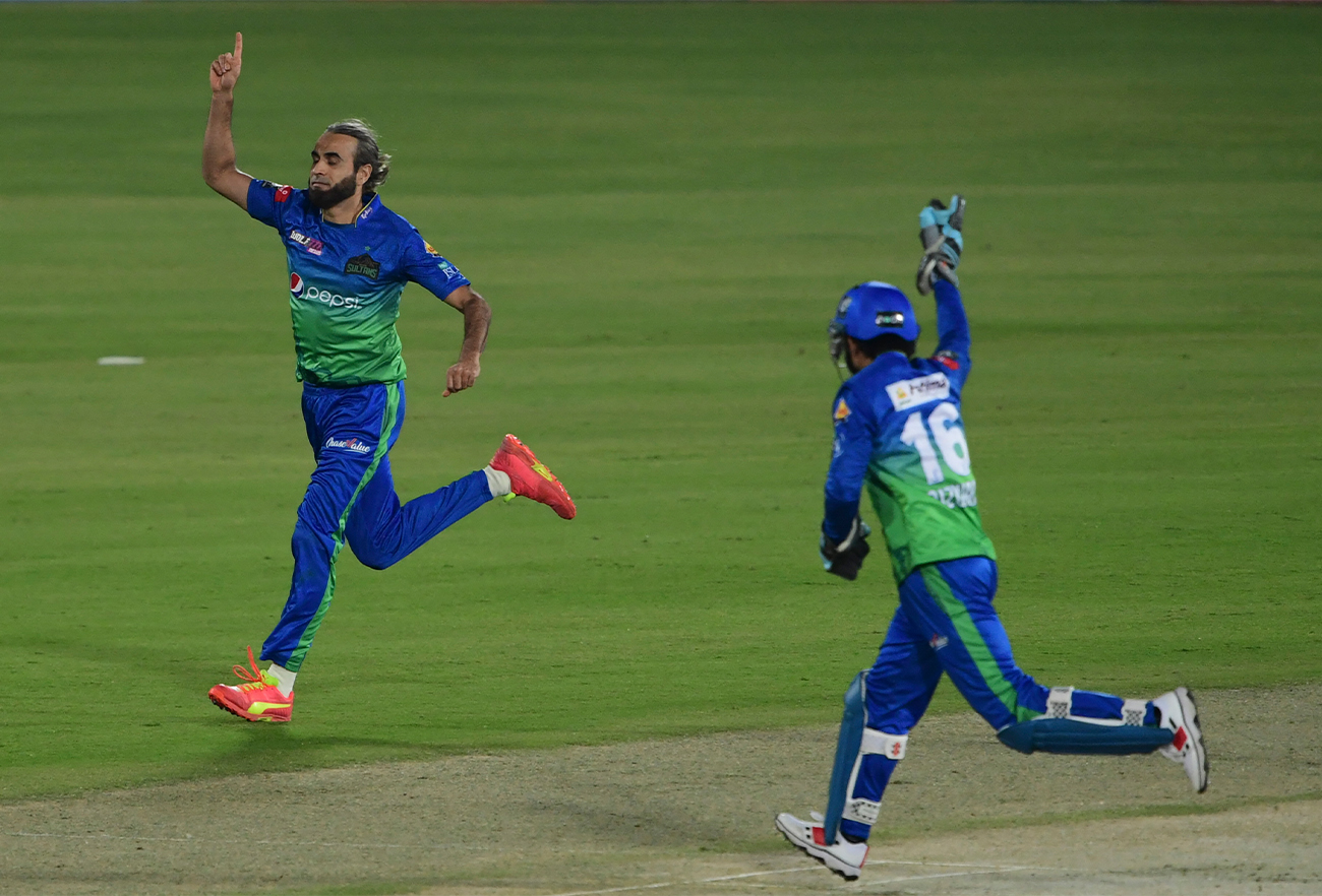 Multan Sultans' Imran Tahir (L) celebrates after taking the wicket of Karachi Kings' Sharjeel Khan (not pictured) during the Pakistan Super League T20 cricket match between Karachi Kings and Multan Sultans in Karachi on January 27, 2022. (AFP)