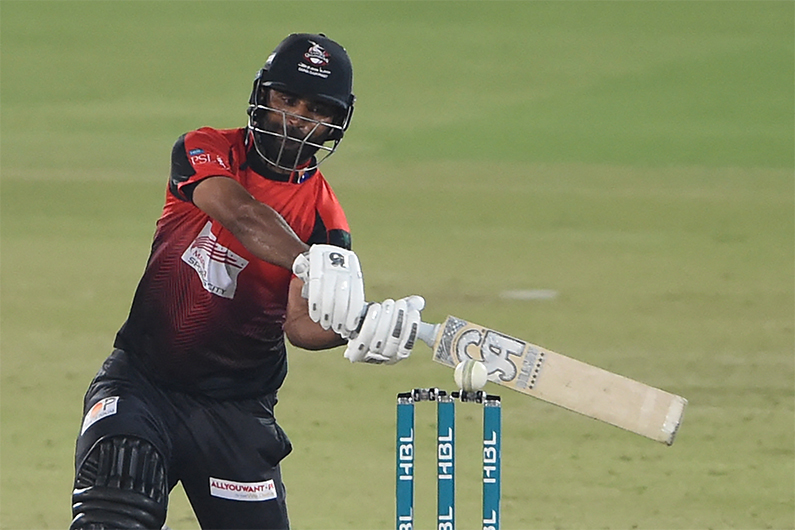 Lahore Qalandars' Fakhar Zaman plays a shot during the Pakistan Super League (PSL) Twenty20 cricket match between Karachi Kings and Lahore Qalandars at the National Cricket Stadium in Karachi on January 30, 2022. (AFP)