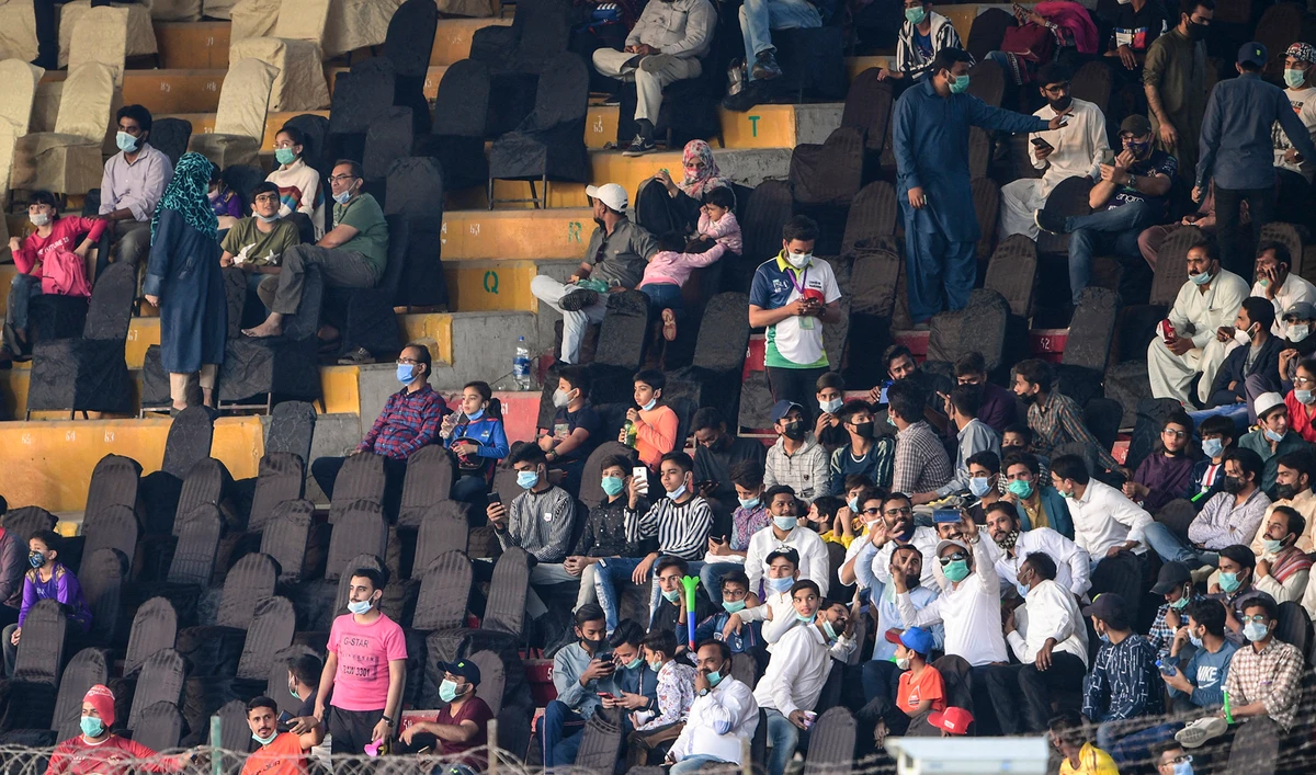 People watch the Pakistan Super League (PSL) T20 cricket match between Islamabad United and Quetta Gladiators at the National Stadium in Karachi on March 2, 2021. (AFP/File)