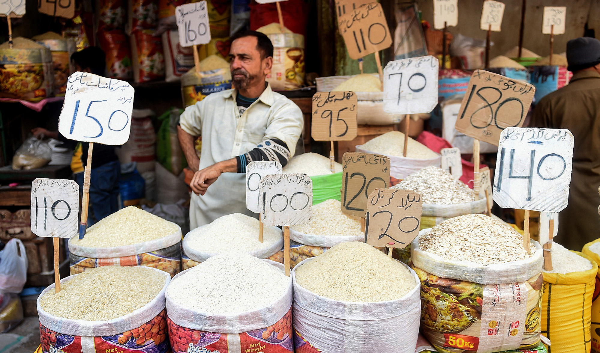 A shopkeeper waits for customers at a market in Karachi, Pakistan on January 10, 2022. (AFP/File)