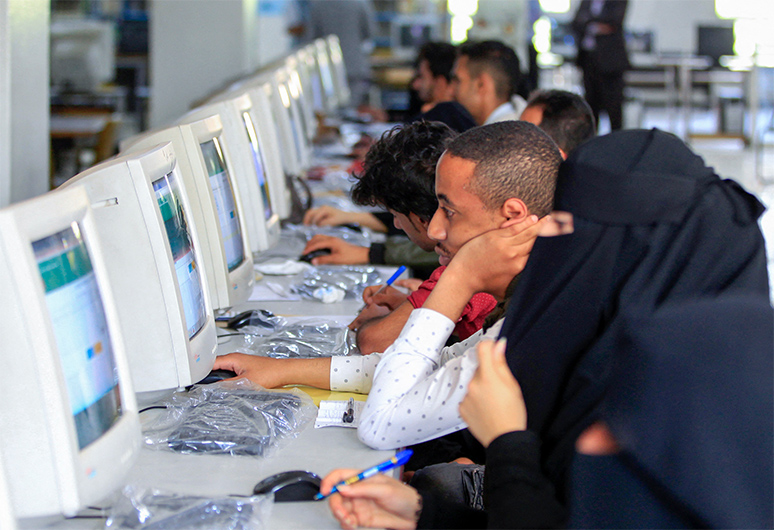 Students sit for an entrance exam at the College of Human Medicine in Sanaa, Yemen, on August 29, 2021. (AFP)