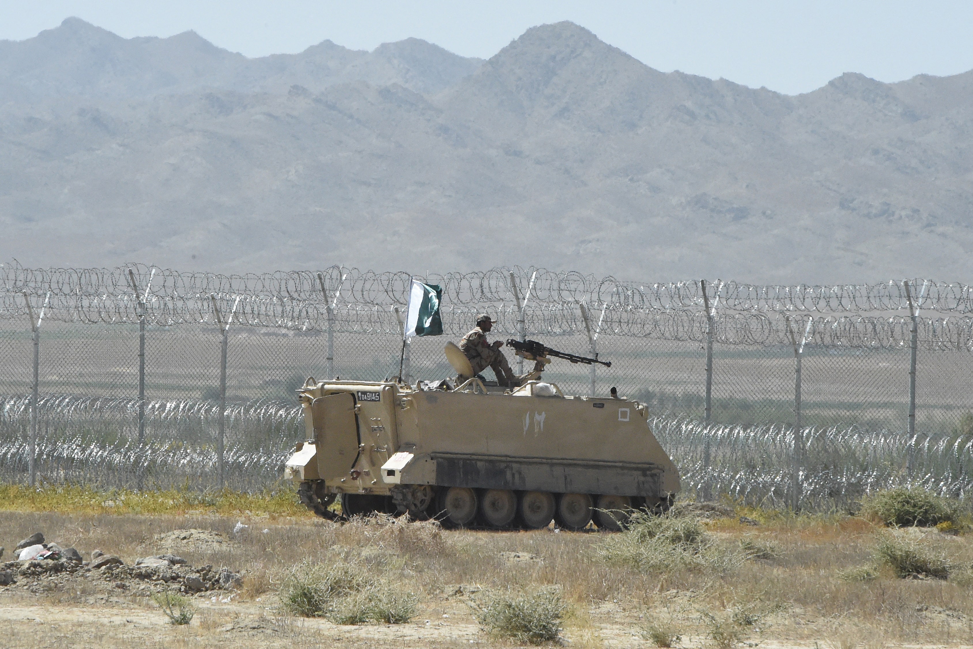 A security personnel of Pakistan's Frontier Corps stands on an armoured vehicle near the newly inaugurated Badini Trade Terminal Gateway, a border crossing point between Pakistan and Afghanistan at the Pakistan's border town of Qila Saifullah in the southwestern province of Balochistan on September 16, 2020. (AFP/ File)