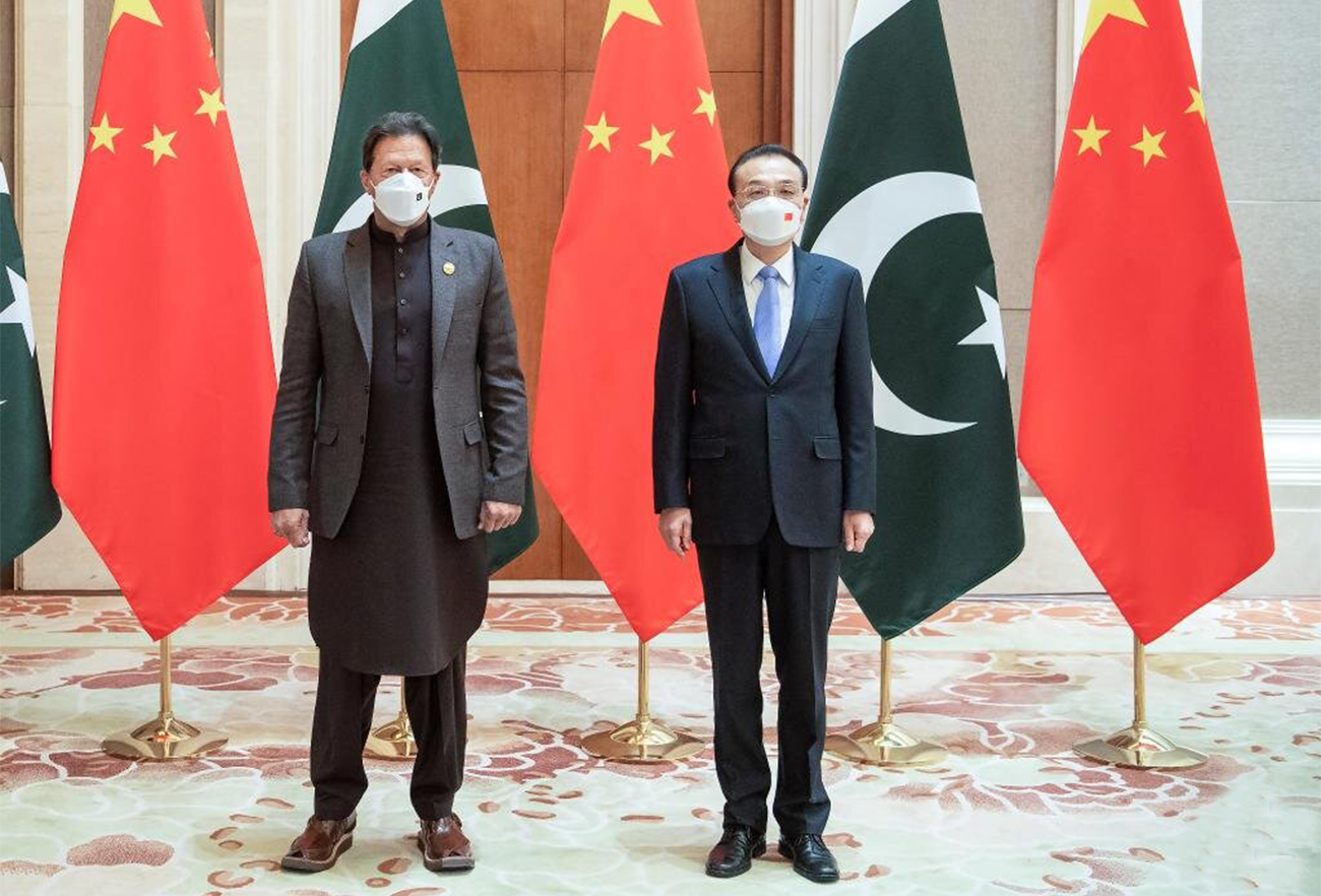Pakistan Prime Minister Imran Khan meets his Chinese counterpart Li Keqiang (right) in Beijing, China, on February 5, 2022. (@PakinChina_/Twitter)