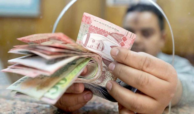 In this file photo, an employee counts Saudi Riyals bills at a money exchange office in central Cairo, Egypt, March 20, 2019. (REUTERS/FILE)