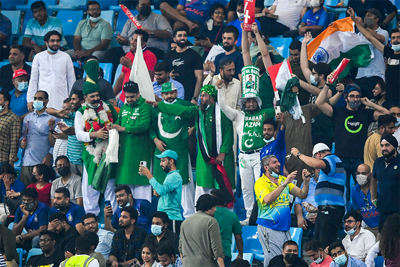 Spectators cheer during the ICC men’s Twenty20 World Cup cricket match between India and Pakistan at the Dubai International Cricket Stadium in Dubai on October 24, 2021. (AFP/FILE)