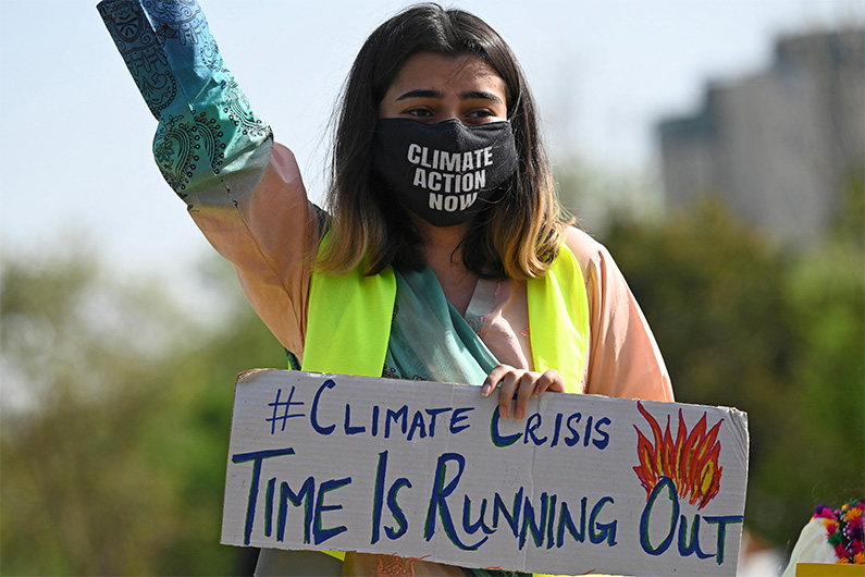 Climate activists hold placards as they take part in a demonstration in support of the environmental and climate protection movement 'Fridays for Future' in Islamabad on March 19, 2021. (AFP/FILE)