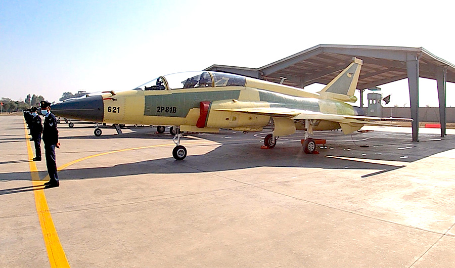 Airmen stand next to a fleet of JF-17 fighter jets at Kamra Airbase in Pakistan on December 19, 2020 . (AN Photo)