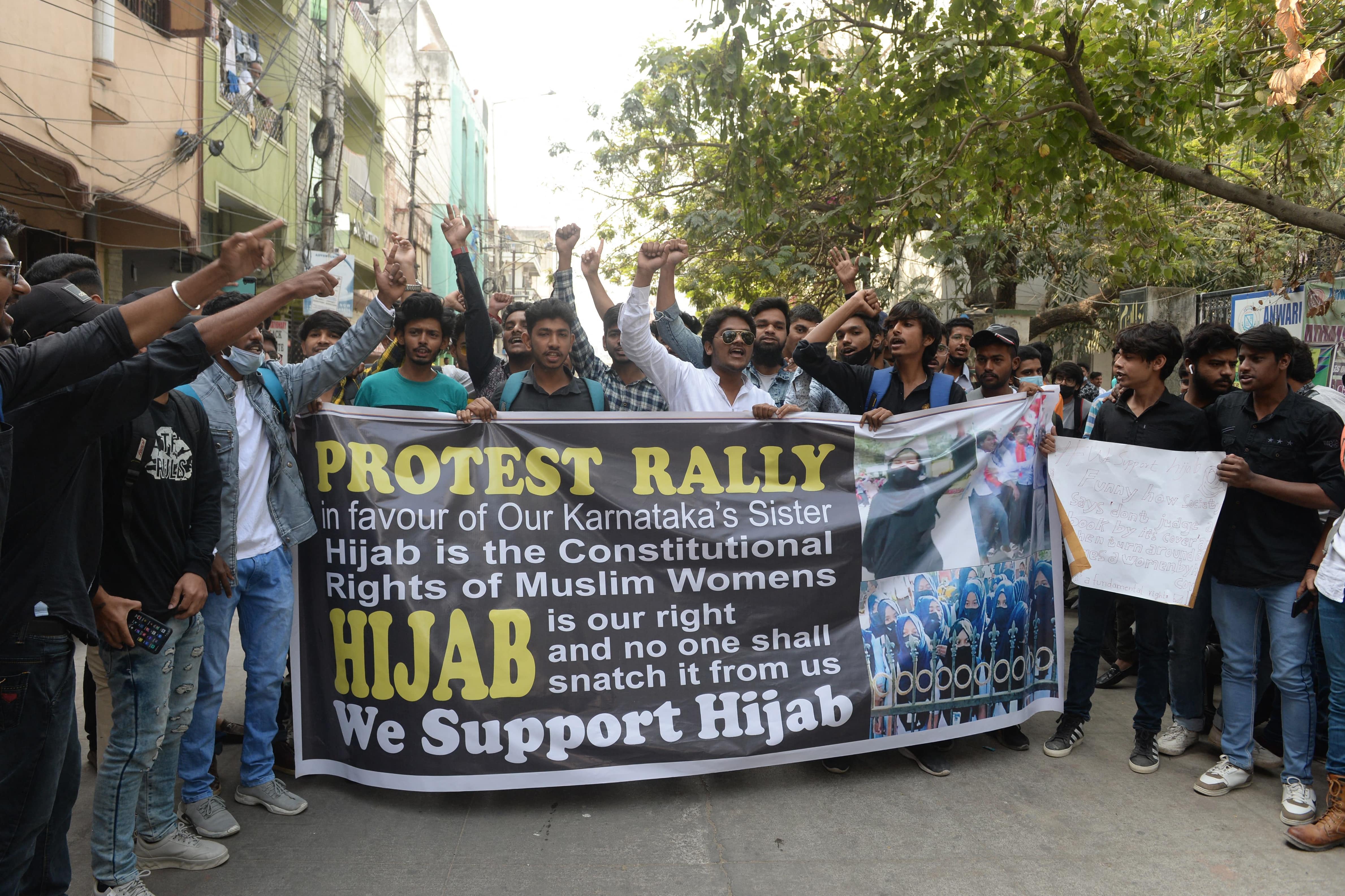 Students from Anwarul Uloom College shout slogans during a protest after educational institutes in Karnataka denied entry to students wearing hijabs, in Hyderabad on February 9, 2022. (AFP)