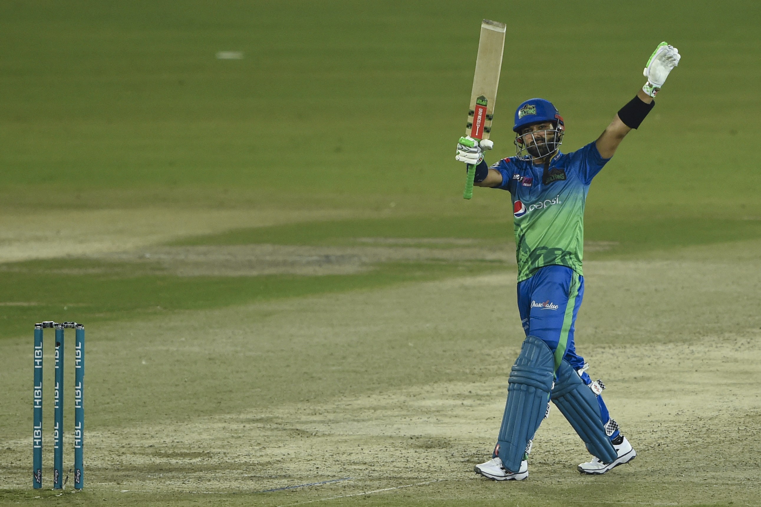 Multan Sultans' captain Mohammad Rizwan celebrates after scoring a half century (50 runs) during the Pakistan Super League (PSL) Twenty20 cricket match between Karachi Kings and Multan Sultans at the National Cricket Stadium in Karachi on January 27, 2022. (AFP)