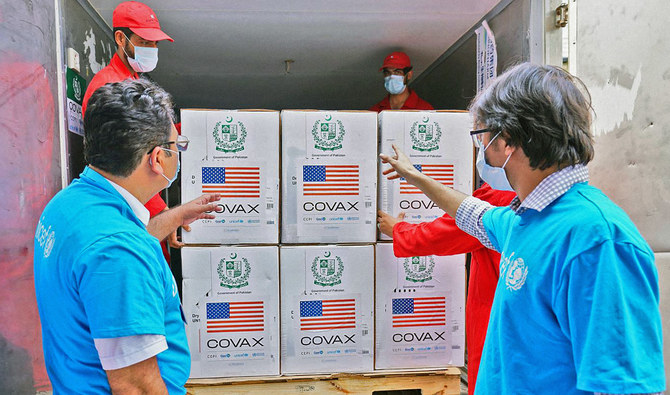In this file photo, volunteers unload the first batch of 10 million doses of US-donated Pfizer COVID-19 vaccine in Islamabad, Pakistan, on August 26, 2021. (Photo courtesy: UNICEF)