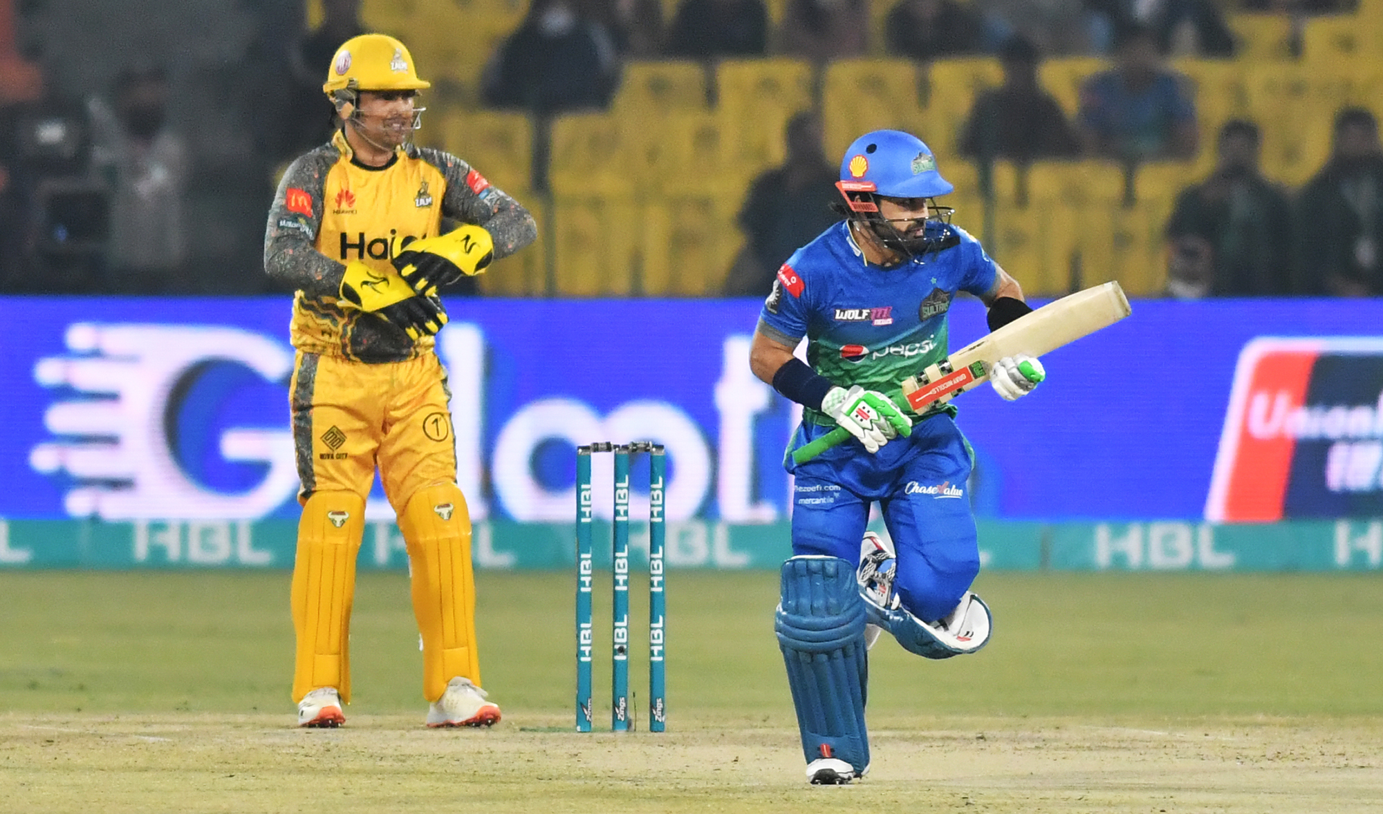Multan Sultans' skipper Mohammad Rizwan, right, takes a run during a Pakistan Super League cricket match against Peshawar Zalmi in Lahore, Pakistan, on February 10, 2022. (Photo courtesy: Pakistan Cricket Board)