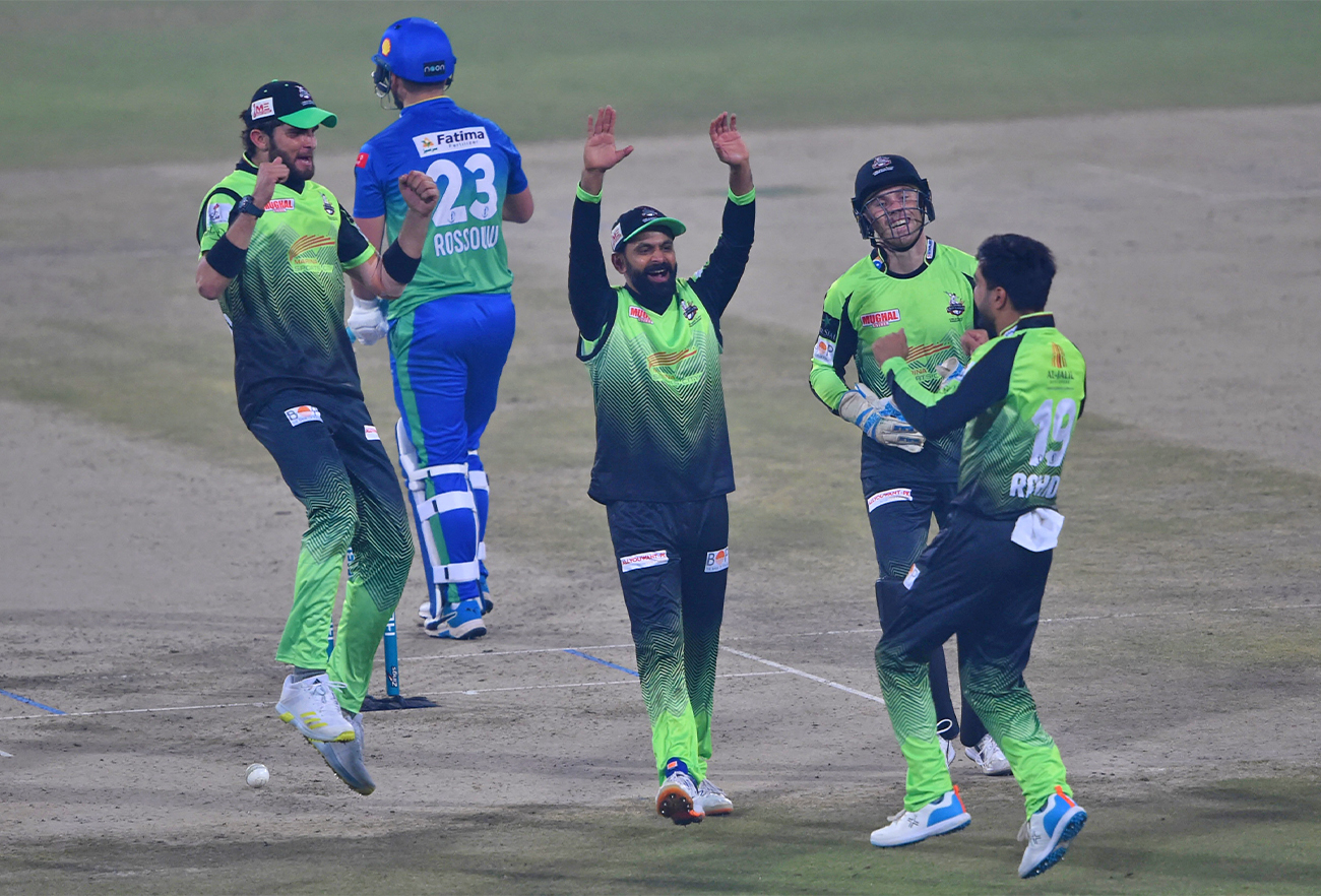 Lahore Qalandars' players celebrate after the dismissal of Multan Sultans' Rilee Rossouw (2nd L) during the PSL T20 cricket match between Multan Sultans and Lahore Qalandars in Lahore on February 11, 2022. (AFP)