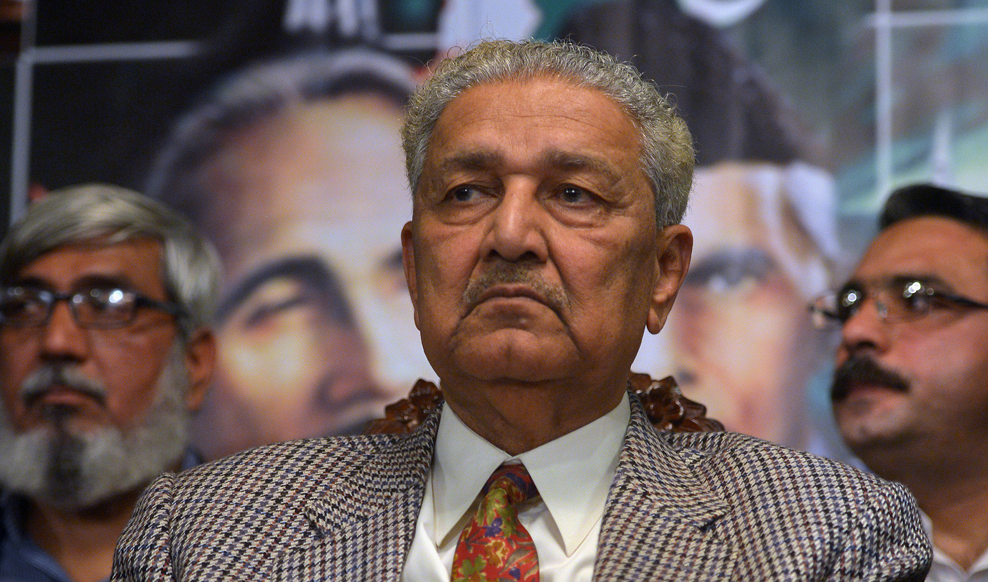 Former Pakistani nuclear scientist and chairman of Tehreek-e-Tahafuz Pakistan party, Abdul Qadeer Khan, sits during a public meeting along with members from the Jamaat-e-Islami party in Islamabad on Feb. 26, 2013. (AFP/File)
