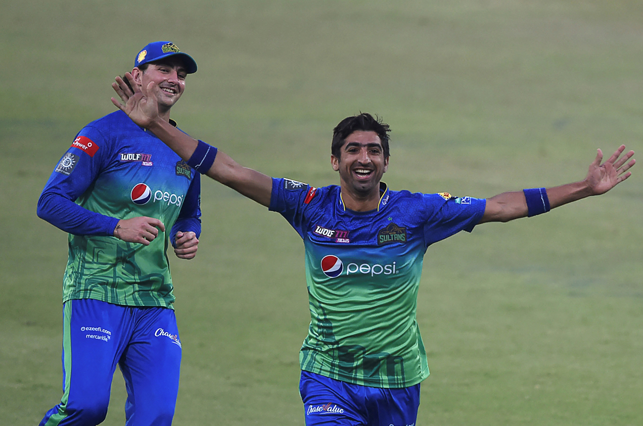 Multan Sultans' Shahnawaz Dahani (R) celebrates after the dismissal of Quetta Gladiators' Noor Ahmad (not pictured) during the Pakistan Super League (PSL) Twenty20 cricket match between Multan Sultans and Quetta Gladiators at the Gaddafi Cricket Stadium in Lahore on February 18, 2022. (AFP)
