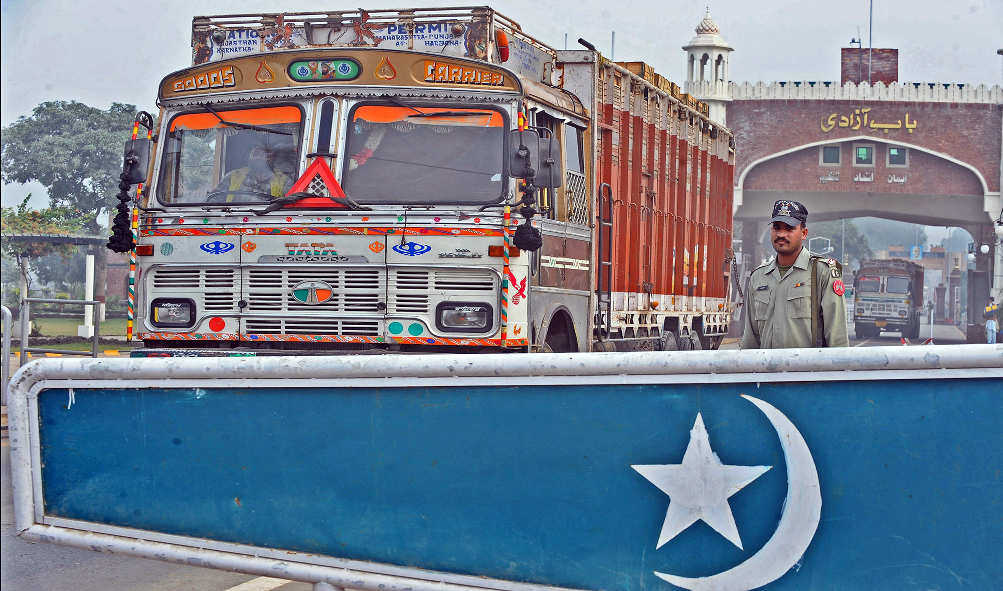 A Pakistani paramilitary soldier stands guard as Indian trucks carrying goods enter the Pakistan-India Wagah border post on November 24, 2011. (AFP/File)