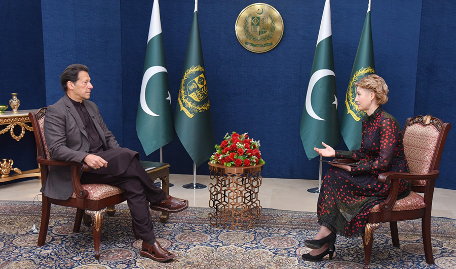 Pakistani Prime Minister Imran Khan (L) pictured during an interview to Russian news channel Russia Today in Islamabad on Feb 21, 2022. (EP Wing)