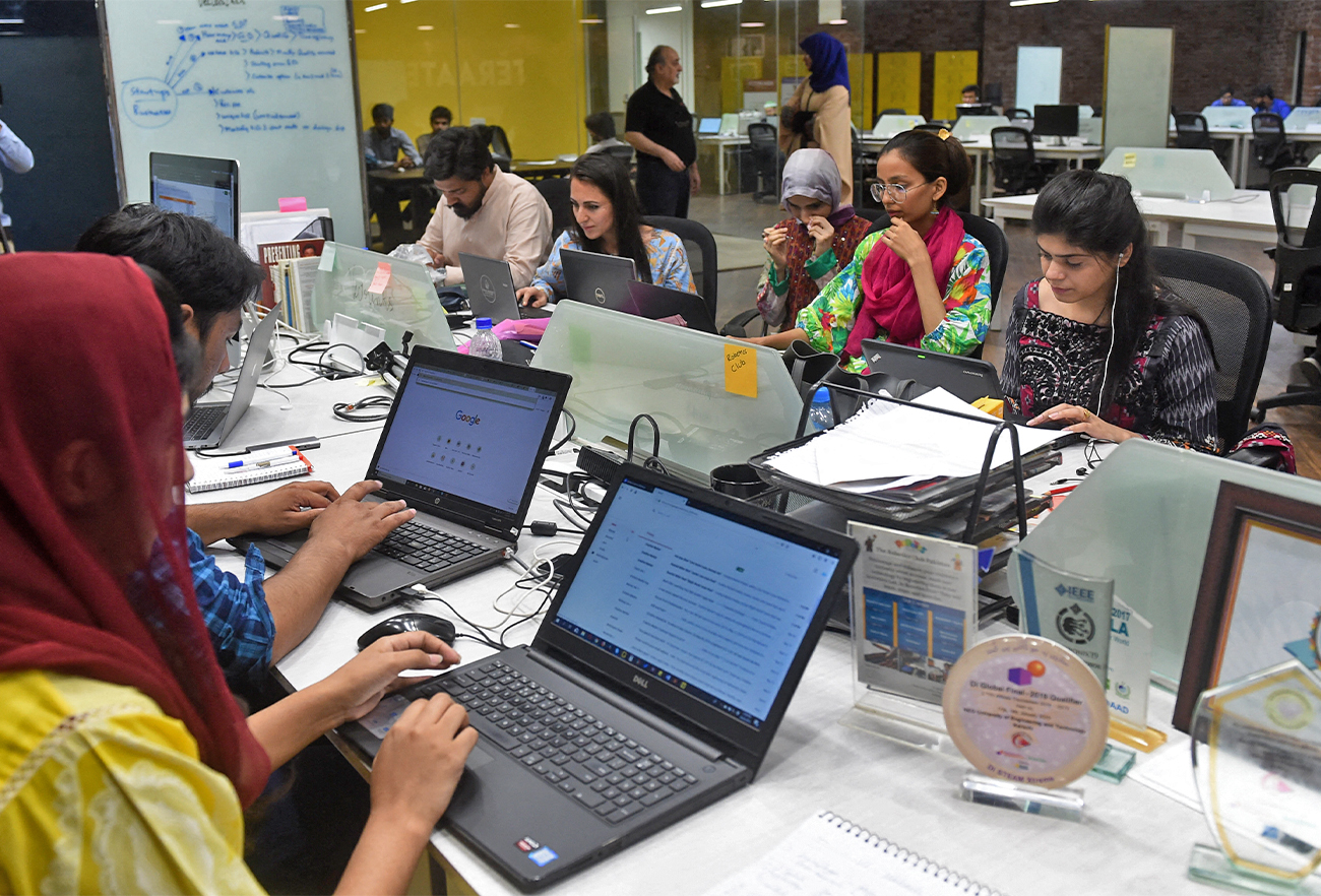 People work at their stations at an incubation centre in Lahore, Pakistan, on May 24, 2019. (AFP/File)