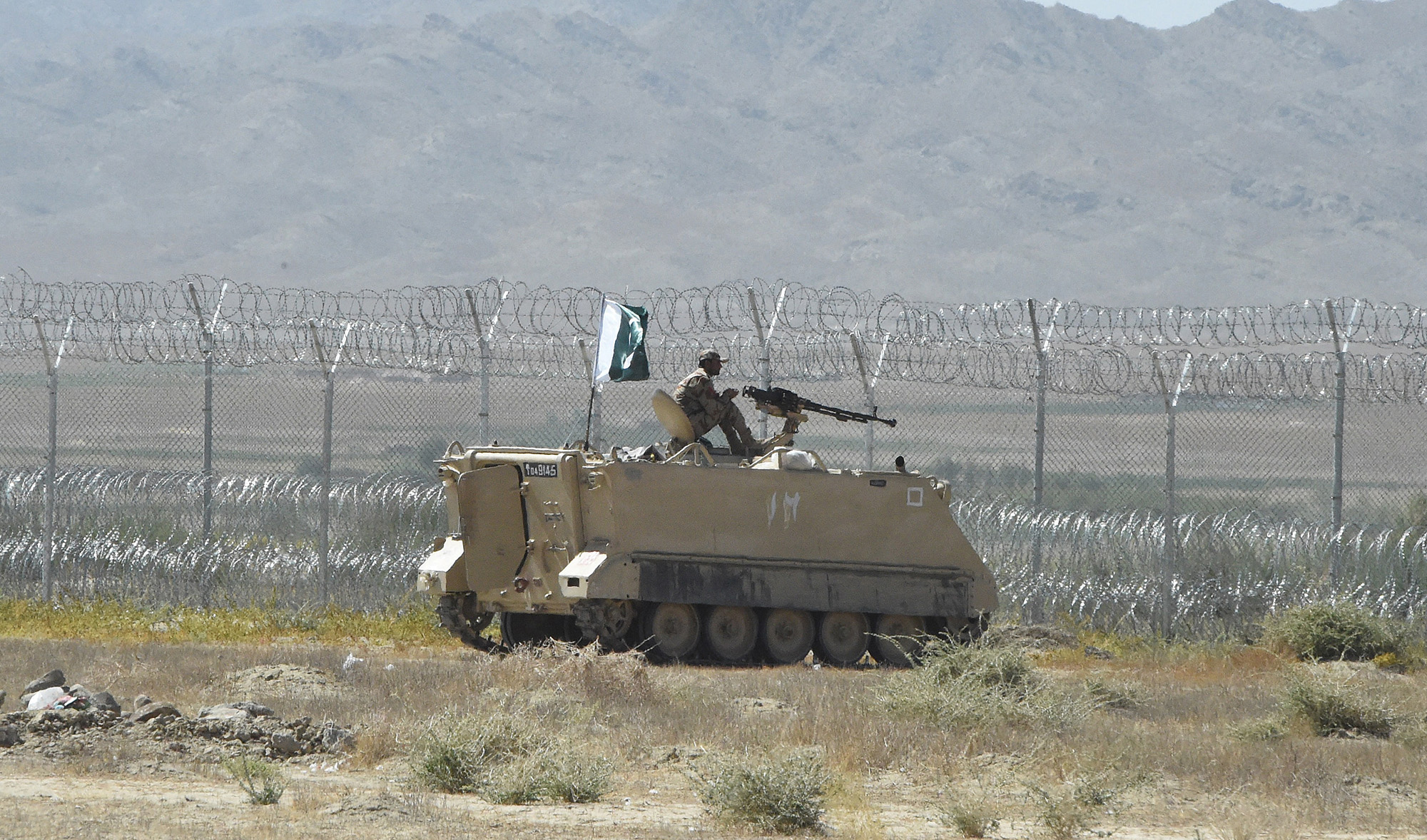 Pakistani security personnel stands on an armored vehicle near a border crossing point between Pakistan and Afghanistan at the Pakistan's border town of Qila Saifullah, Balochistan, on September 16, 2020. (AFP/File)