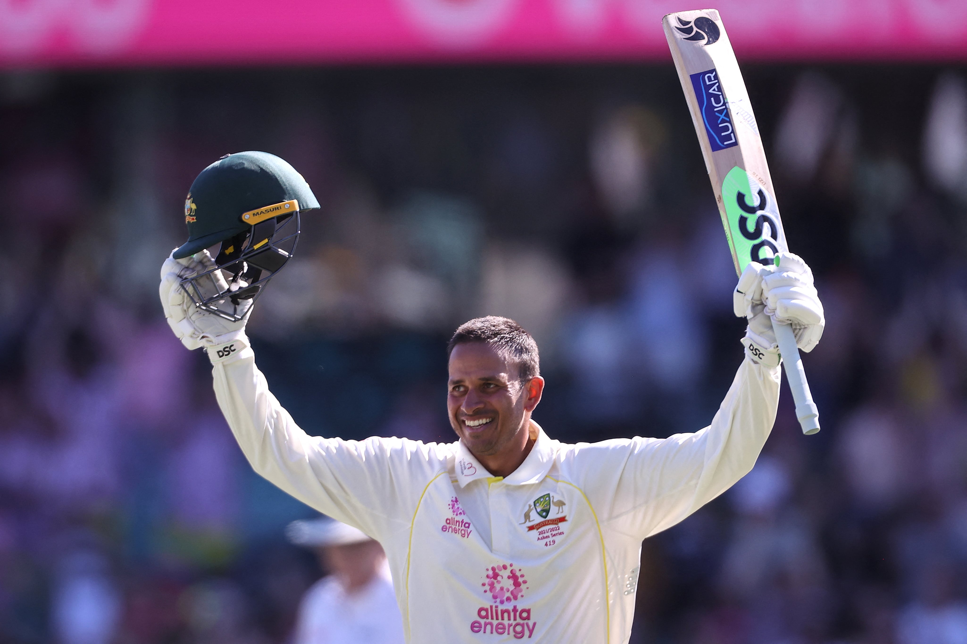 Australia's Usman Khawaja celebrates reaching his century (100 runs) on day four of the fourth Ashes cricket test between Australia and England at the Sydney Cricket Ground (SCG) on January 8, 2022. (AFP)