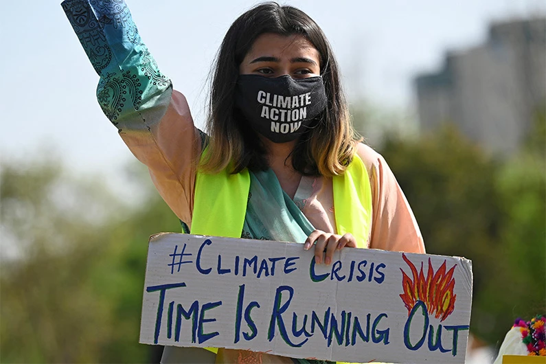 Climate activists hold placards as they take part in a demonstration in support of the environmental and climate protection movement 'Fridays for Future' in Islamabad on March 19, 2021. (AFP/FILE)