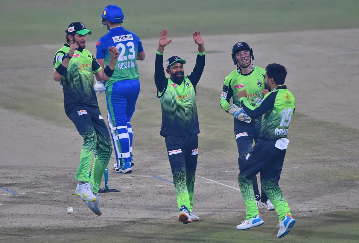 Lahore Qalandars' players celebrate after the dismissal of Multan Sultans' Rilee Rossouw (2nd L) during the PSL T20 cricket match between Multan Sultans and Lahore Qalandars in Lahore on February 11, 2022. (AFP)