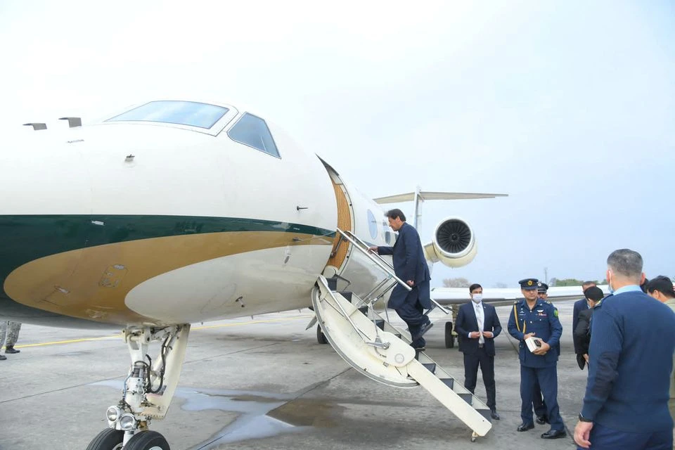 Pakistan's Prime Minister Imran Khan boards a plane before his departure to Moscow, for his two day visit to Russia, at an airbase in Islamabad, Pakistan February 23, 2022. (REUTERS)