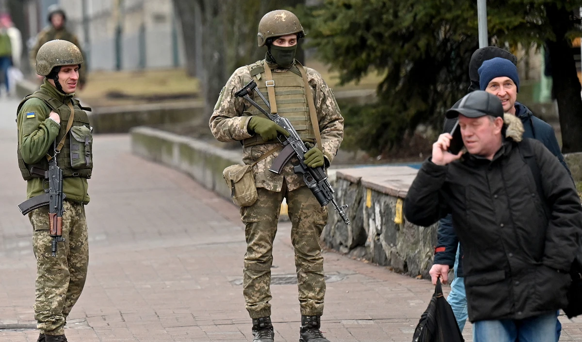 Ukrainian Military Forces servicemen stand guard in Kyiv on February 24, 2022 as Russia's ground forces invaded Ukraine from several directions. (AFP/File)