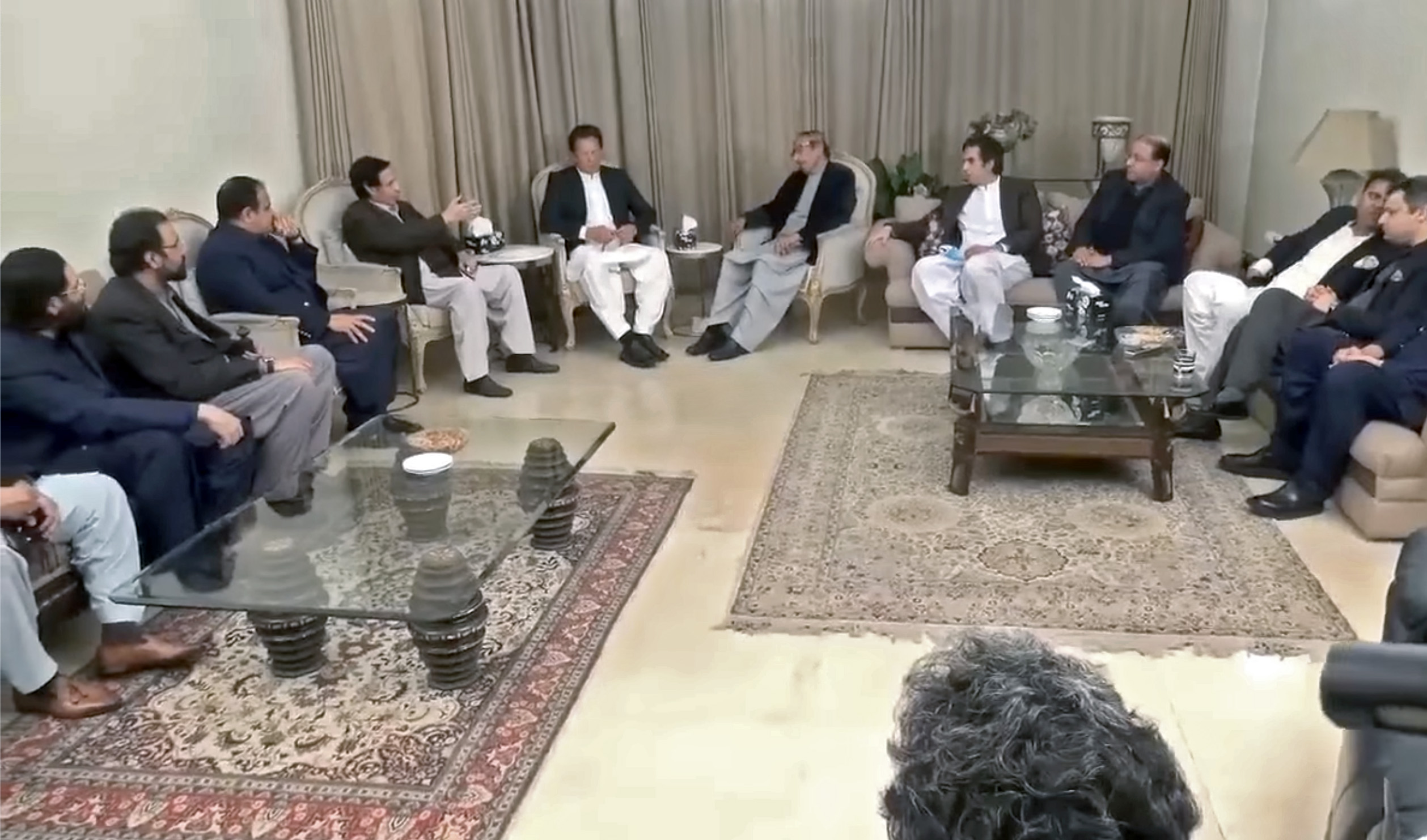 Pakistan Prime Minister Imran Khan, (5th L), with his allies in Lahore on March 1, 2022. (Photo courtesy: @PTIOfficial/Facebook)