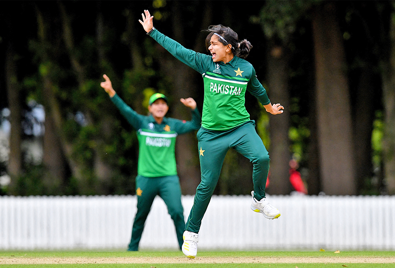 Pakistan's Fatima Sana (R) celebrates after taking a wicket during the warm-up match against Bangladesh at Lincoln Green in Lincoln, England, on March 2, 2022, ahead of the Women's Cricket World Cup tournament. (AFP/File)