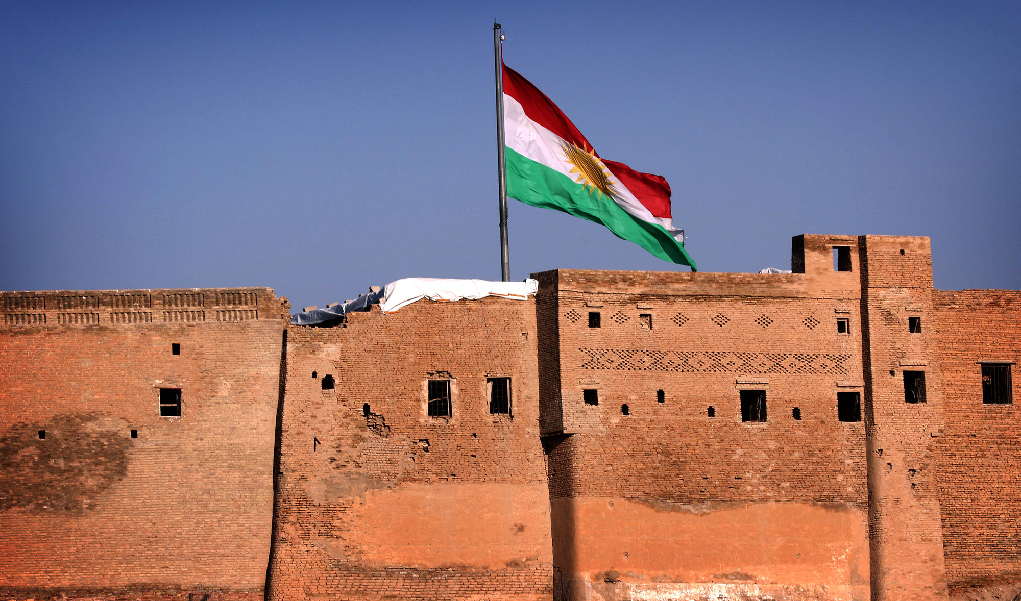 Kurdish flag waving over the Erbil Citadel in the capital of the autonomous Kurdish region of northern Iraq on February 3, 2016. (AFP/File)