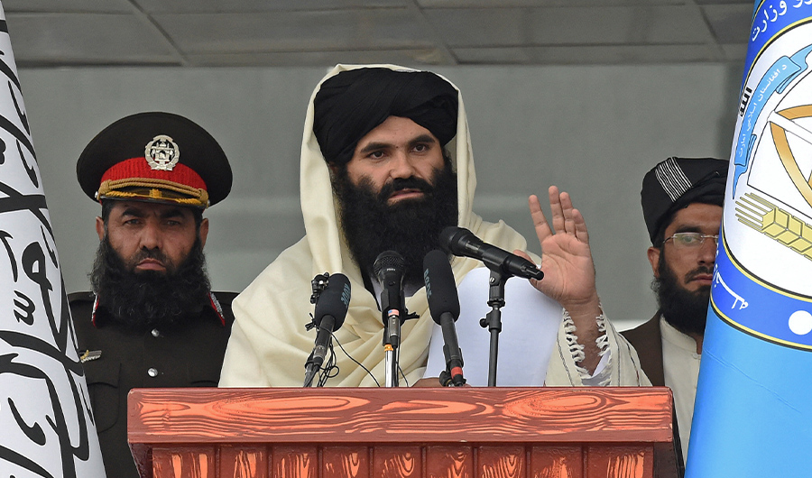 Taliban Interior Minister Sirajuddin Haqqani speaks to new Afghan police recruits during a graduation ceremony at the police academy in Kabul on March 5, 2022. (AFP)