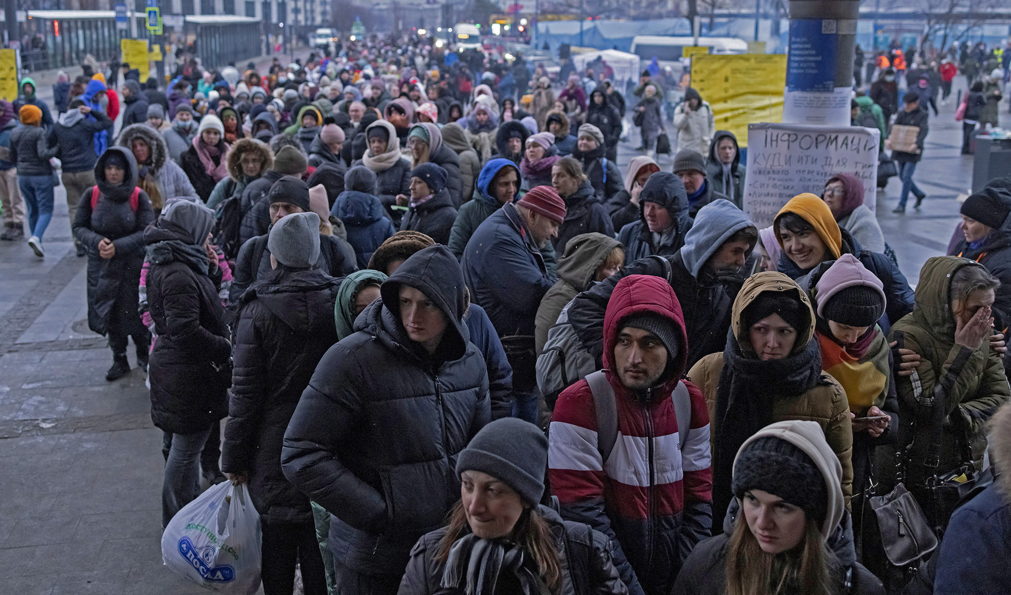 Refugees queue for trains to Poland following the Russian invasion of Ukraine, at the train station in Lviv, Ukraine, on March 7, 2022. (REUTERS)
