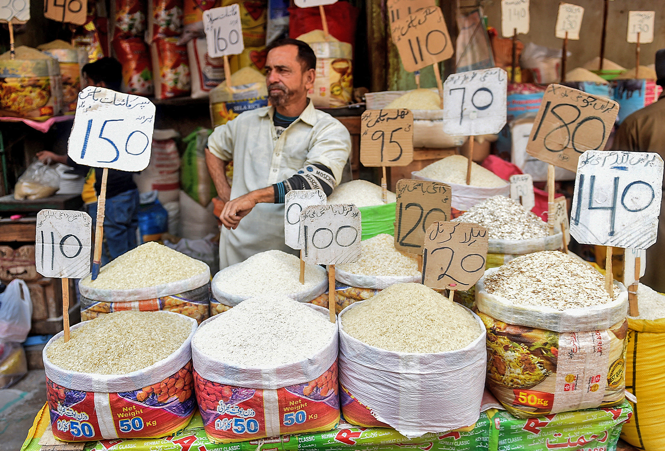 In this picture taken on January 10, 2022, a shopkeeper waits for customers at a market in Karachi, Pakistan. (AFP/File)