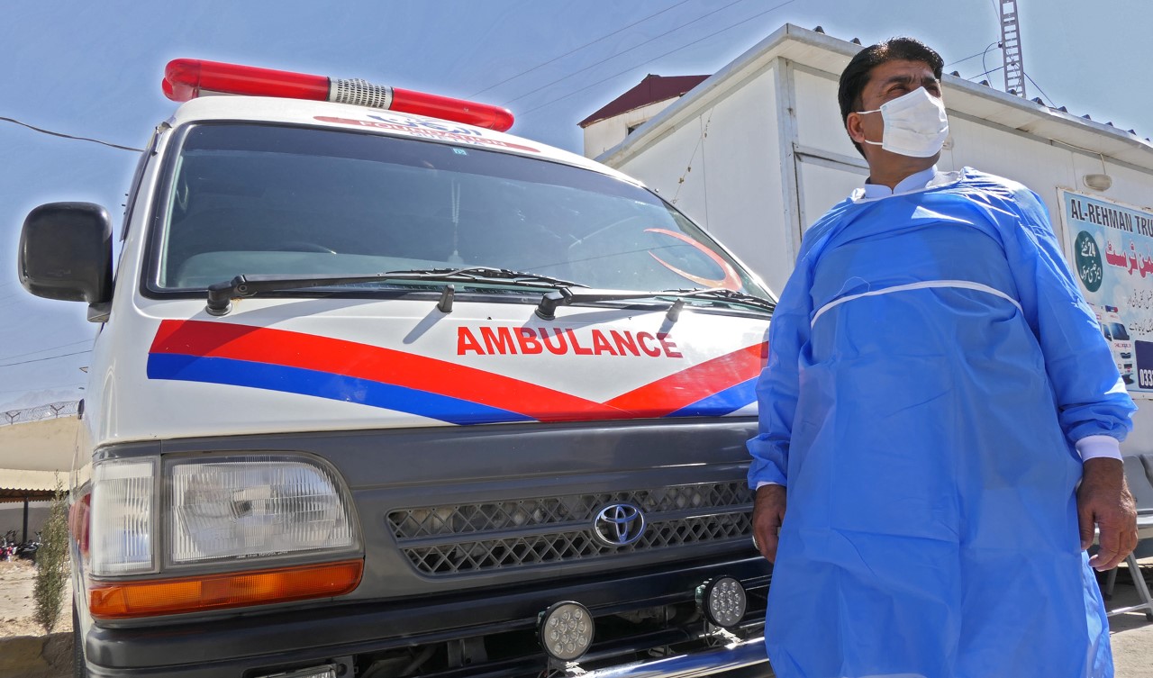 Coronavirus Rescue Operation leader Babul Khan Jattak stands in front of an ambulance parked inside the BMC Hospital Quetta, Pakistan, on March 7, 2022. (AN photo)