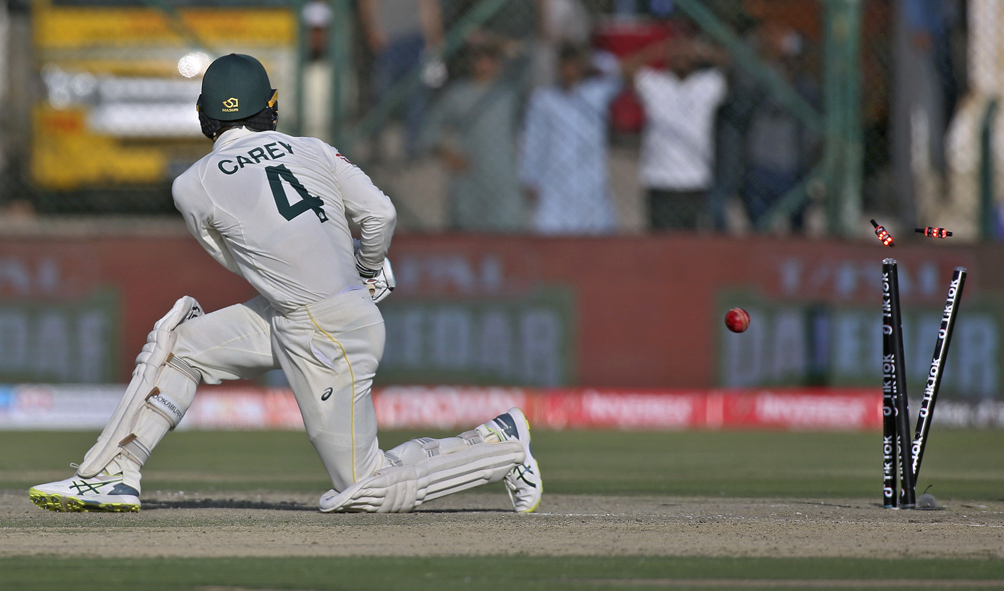 Australia's Alex Carey is bowled out by Pakistan's Babar Azam during the second day of the second test match at the National Stadium, in Karachi, Pakistan on March 13, 2022. (AP)