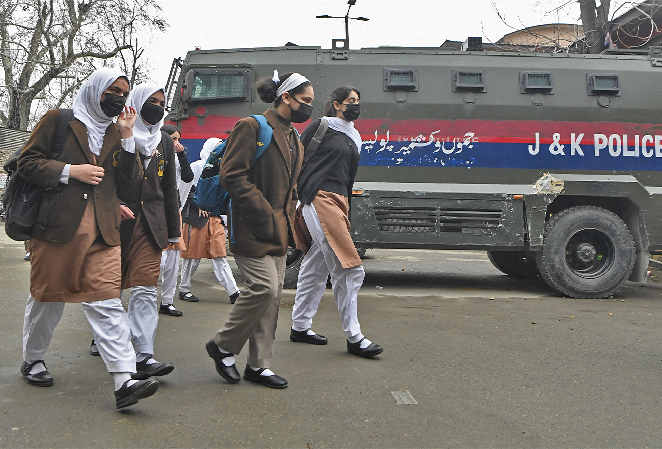 Students walk towards the school in Srinagar on March 2, 2022. (AFP/File)