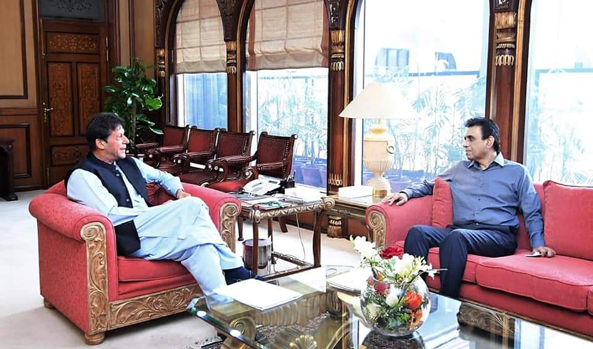 Khalid Maqbool Siddiqui, right, calls on Prime Minister Imran Khan in Islamabad, Pakistan, on May 17, 2019. (Photo courtesy: @PTIOfficialMTN/Twitter)