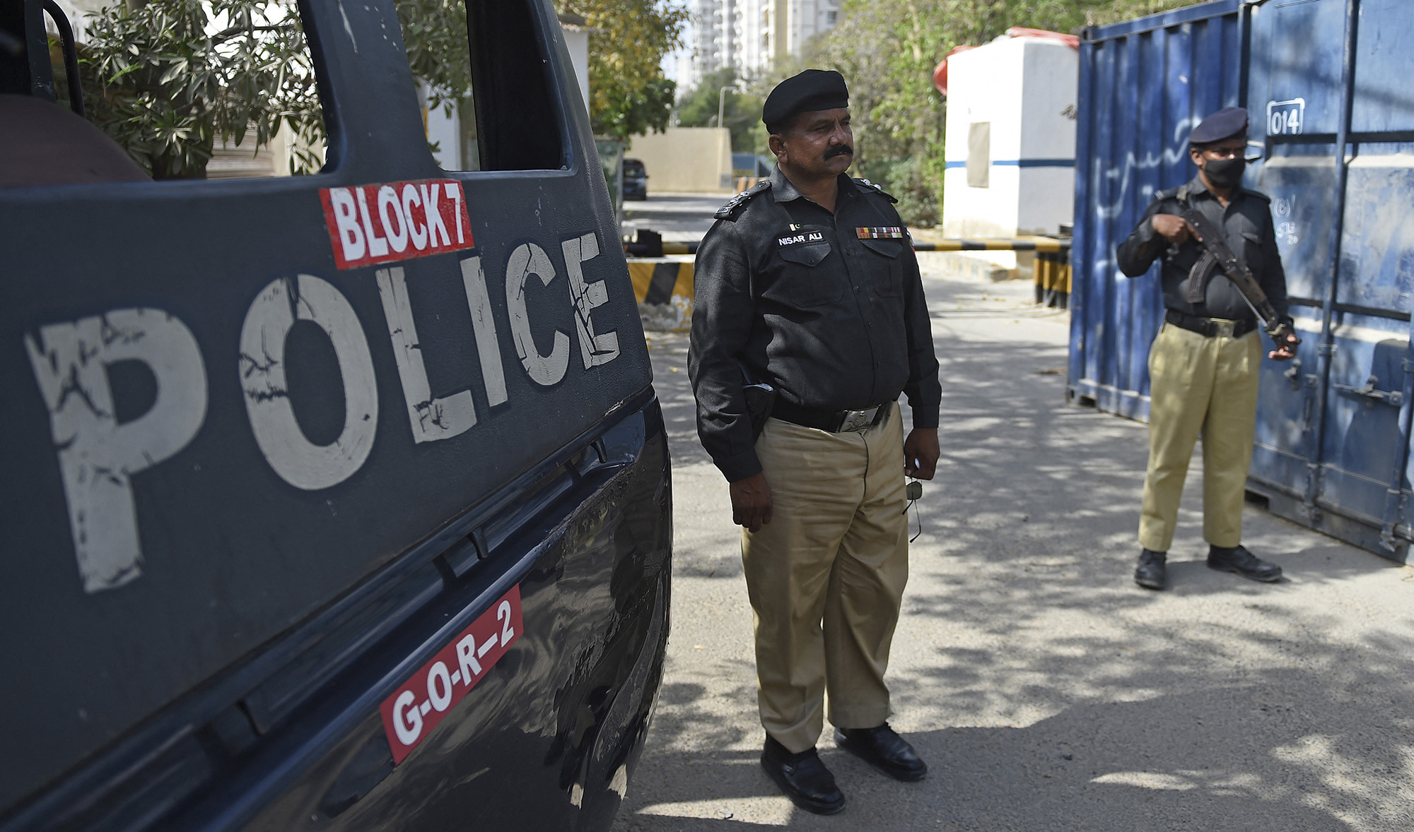 Police stand guard near the French Consulate building in Karachi on April 15, 2021. (AFP/File)