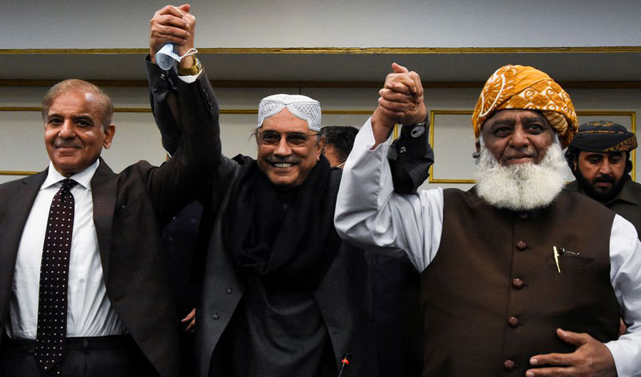 Leaders of the opposition parties Shahbaz Sharif, leader of PML-N, Asif Ali Zardari, co-chairman of PPP, and Fazal-ur Rehman, president of JUI-F, raise their hands after a news conference in Islamabad, Pakistan March 8, 2022. (REUTERS)