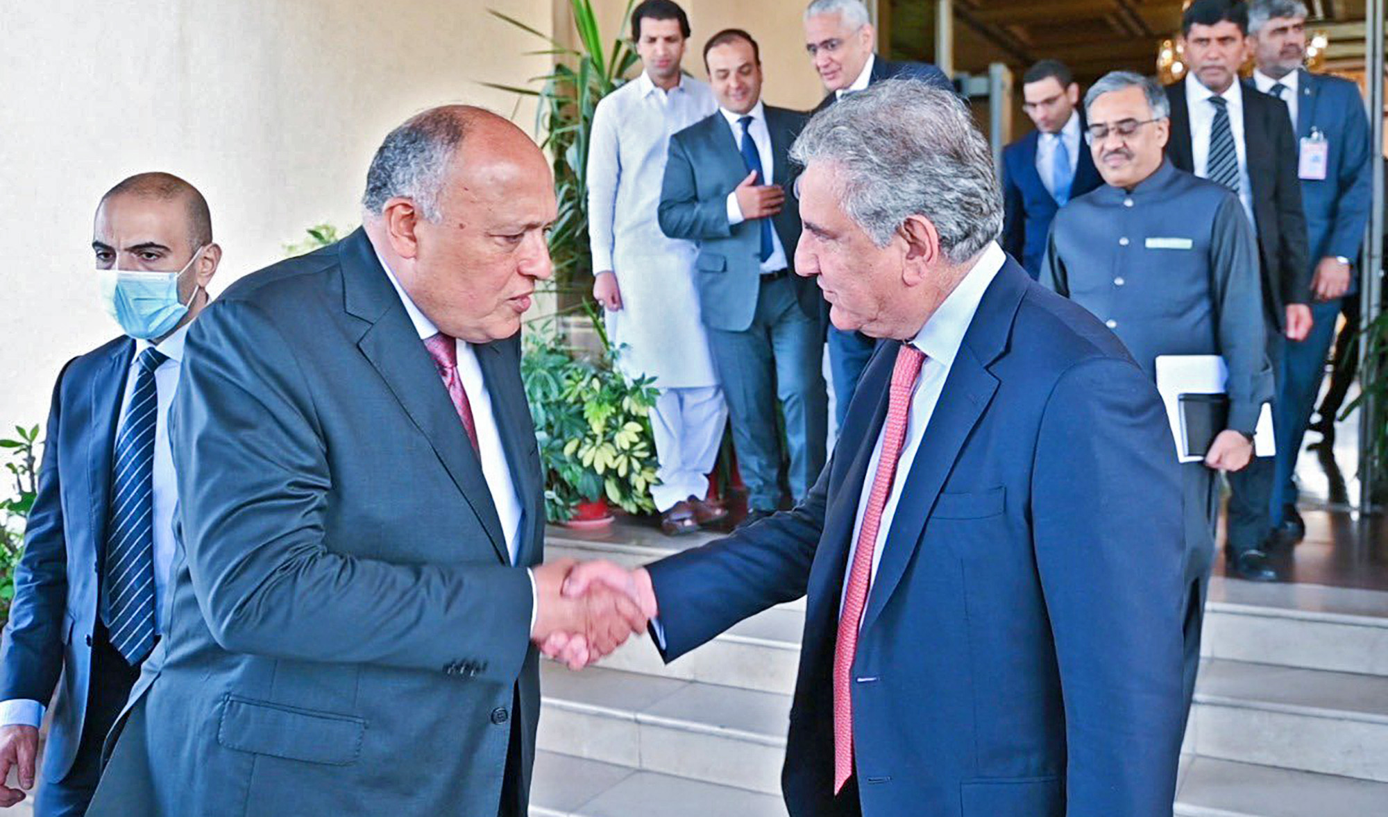 Pakistan's foreign minister Shah Mahmood Qureshi, right, receives his Egyptian counterpart Sameh Hassan Shoukry at the Ministry of Foreign Affairs in Islamabad on March 20, 2022. (Photo courtesy: Pakistan foreign office)