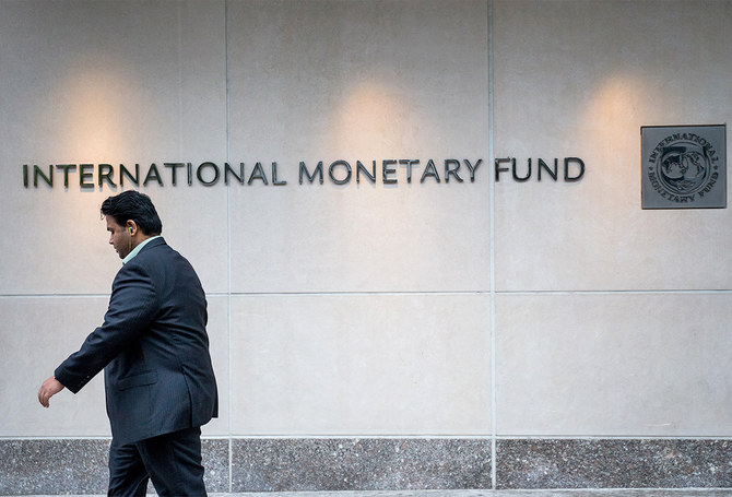 A man walks past the IMF Headquarters in Washington, US, on September 30, 2016. (AFP/File)