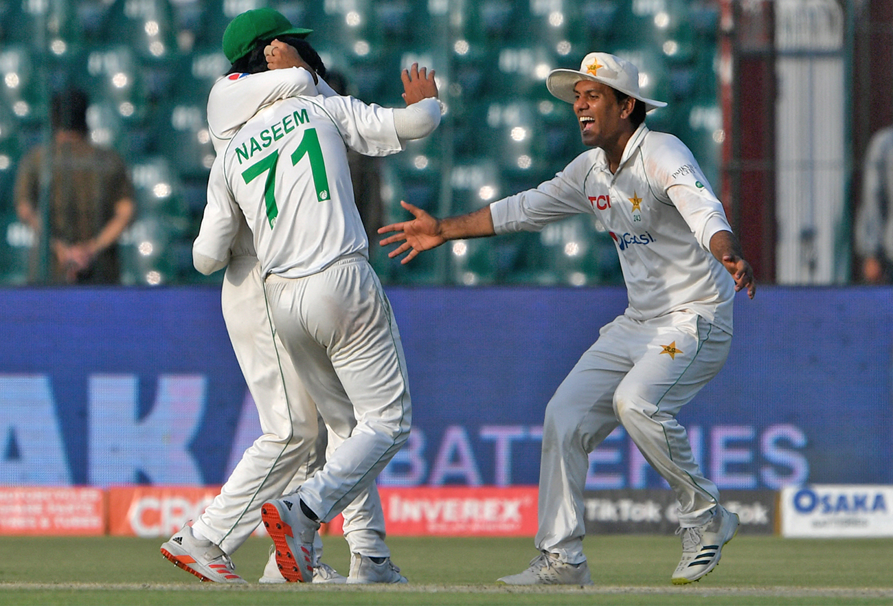 Pakistan's Naseem Shah (C) celebrates with teammates after taking the wicket during the first day of the third Test cricket match between Pakistan and Australia in Lahore on March 21, 2022. (AFP)