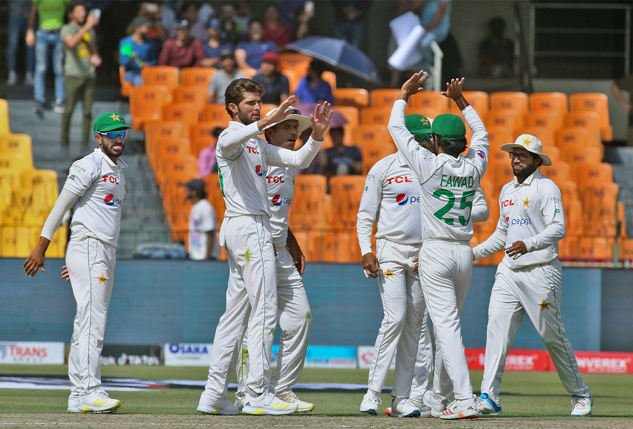 Pakistan's Shaheen Shah Afridi, second left, celebrates with teammates after taking the wicket of Australia's Mitchell Starc on the second day play of the third test match between Pakistan and Australia in Lahore, Pakistan, on March 22, 2022. (AP)