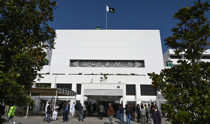 In this file photo, Pakistani media personnel gather outside the Parliament building during a joint session in Islamabad on February 28, 2019. (AFP/FILE)